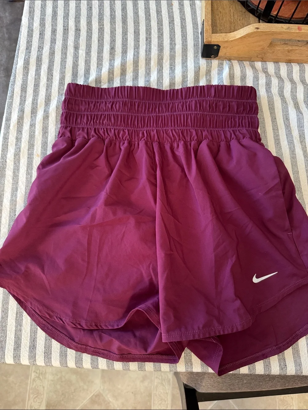 Nike Women's Burgundy Athletic Shorts with White Swoosh